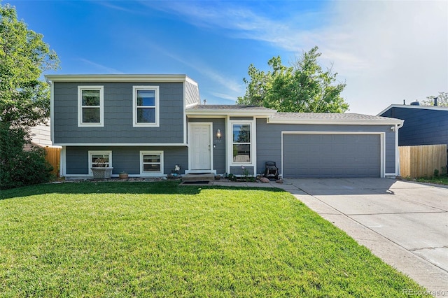 19523 E Buchanan Pl, Aurora, CO 80011 - tri-level home featuring concrete driveway and a garage