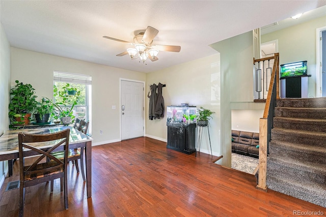 19523 E Buchanan Pl, Aurora, CO 80011 - dining area featuring wood finished floors, stairway, ceiling fan, and baseboards