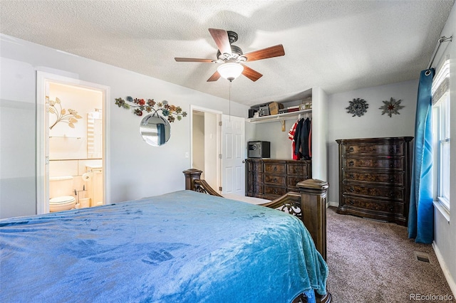 19523 E Buchanan Pl, Aurora, CO 80011 - bedroom with carpet floors, a textured ceiling, ceiling fan, a closet, and ensuite bath