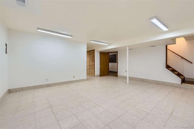 8644 S Brentwood St, Littleton, CO 80128 - finished basement featuring stairs and light tile patterned floors