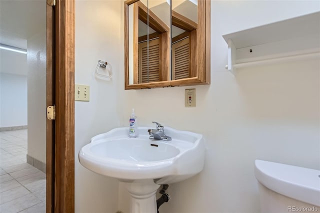 8644 S Brentwood St, Littleton, CO 80128 - half bathroom with tile patterned flooring and toilet