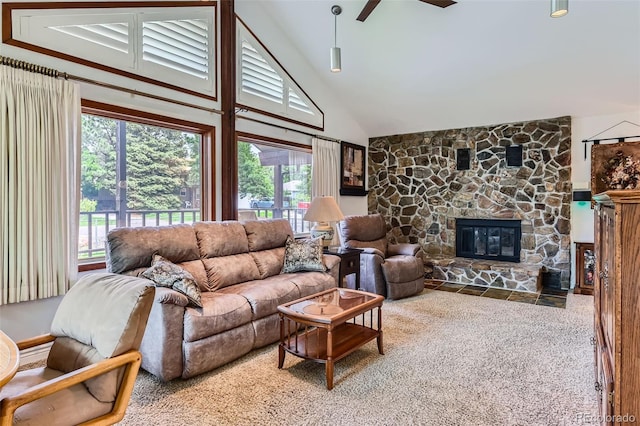8644 S Brentwood St, Littleton, CO 80128 - living area with high vaulted ceiling, carpet, a stone fireplace, and ceiling fan