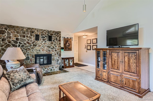 8644 S Brentwood St, Littleton, CO 80128 - living room featuring carpet flooring, a stone fireplace, and high vaulted ceiling