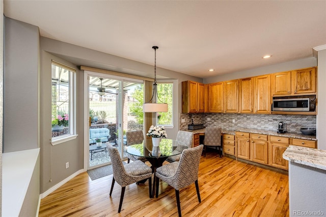 22685 E Calhoun Pl, Aurora, CO 80016 - dining space with light wood finished floors, baseboards, and recessed lighting
