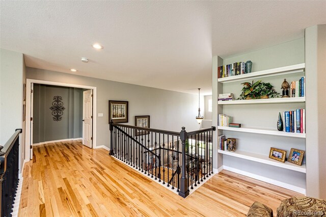22685 E Calhoun Pl, Aurora, CO 80016 - hallway featuring an upstairs landing, wood finished floors, and recessed lighting