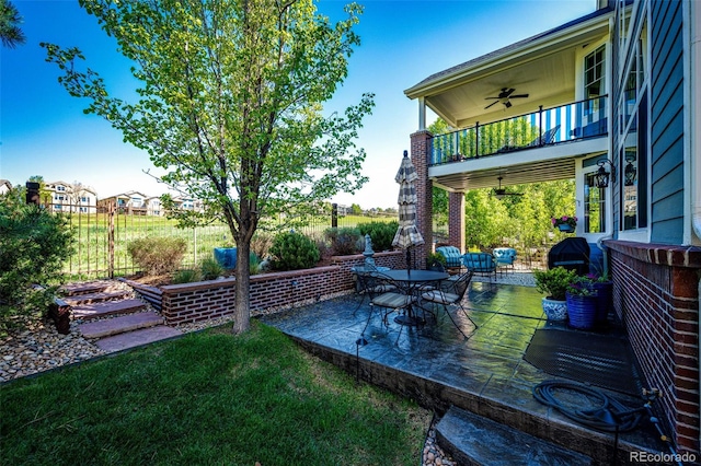 22685 E Calhoun Pl, Aurora, CO 80016 - view of yard with a balcony, a ceiling fan, and a patio area