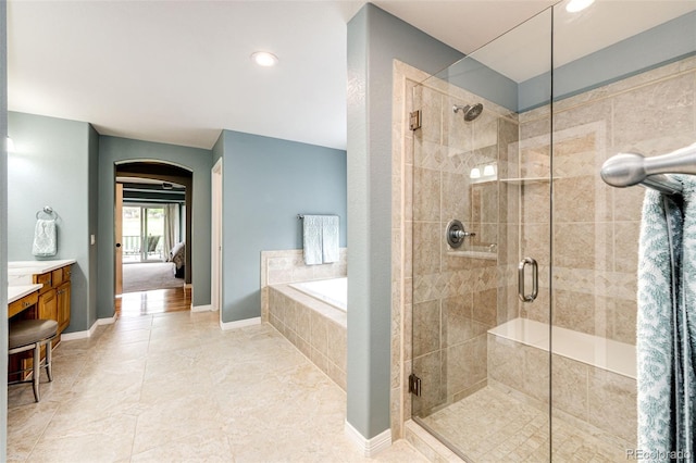 22685 E Calhoun Pl, Aurora, CO 80016 - full bath with a garden tub, a shower stall, vanity, recessed lighting, and tile patterned floors