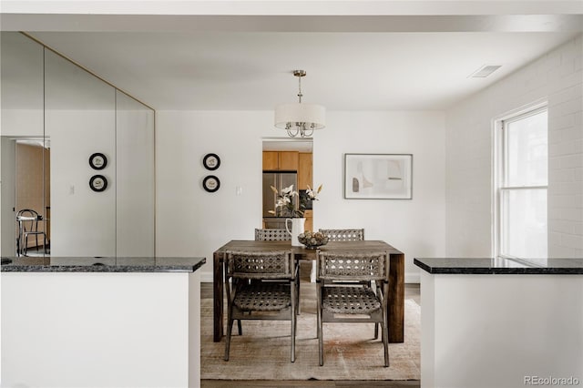 420 S Marion Pkwy Unit 203, Denver, CO 80209 - dining area with wood finished floors