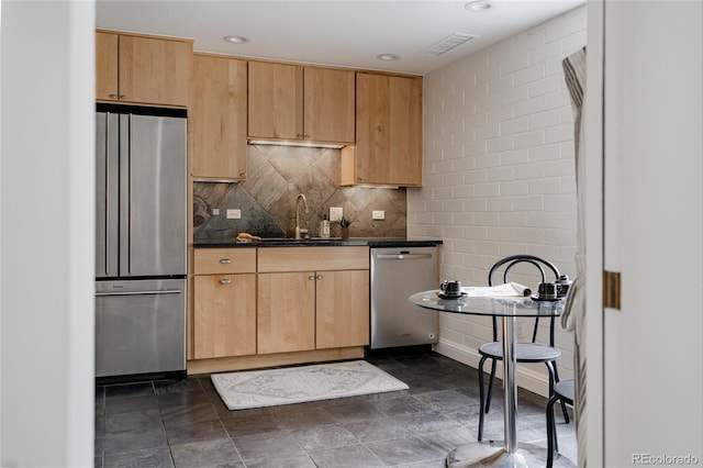 420 S Marion Pkwy Unit 203, Denver, CO 80209 - kitchen with appliances with stainless steel finishes, decorative backsplash, light brown cabinetry, and recessed lighting
