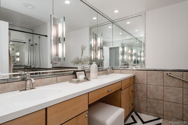 420 S Marion Pkwy Unit 203, Denver, CO 80209 - full bathroom with tile walls, double vanity, and recessed lighting