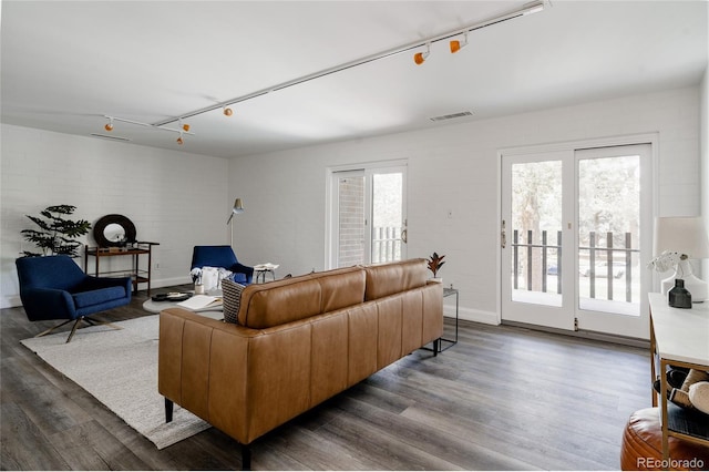 420 S Marion Pkwy Unit 203, Denver, CO 80209 - living room featuring track lighting, wood finished floors, and plenty of natural light