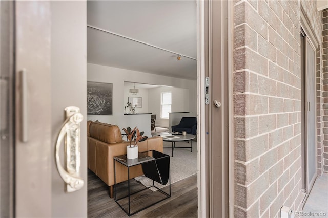 420 S Marion Pkwy Unit 203, Denver, CO 80209 - living room with wood finished floors and brick wall