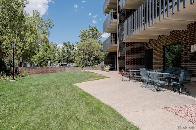 420 S Marion Pkwy Unit 203, Denver, CO 80209 - view of grassy yard with a patio and a balcony