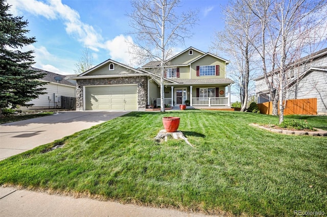 traditional home with a porch, driveway, and a garage