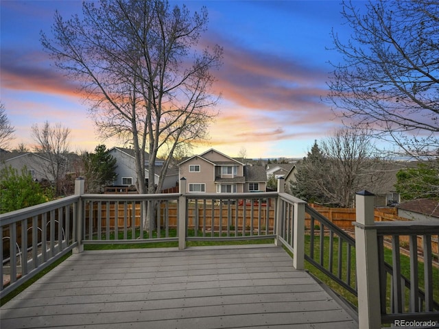deck with a residential view and a fenced backyard
