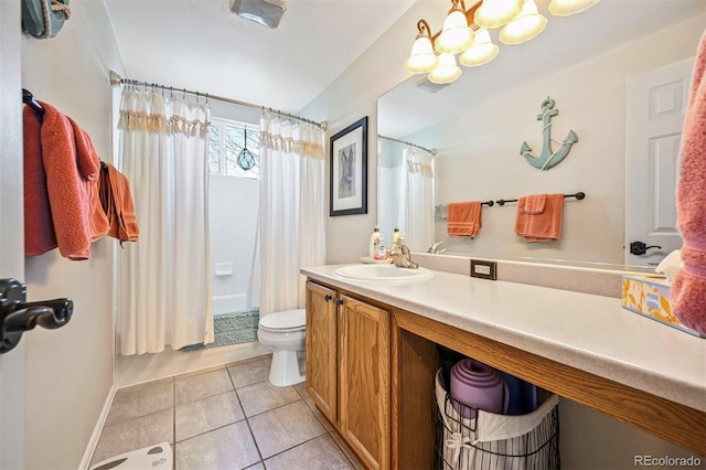 full bath with toilet, a chandelier, vanity, tile patterned floors, and shower / tub combo