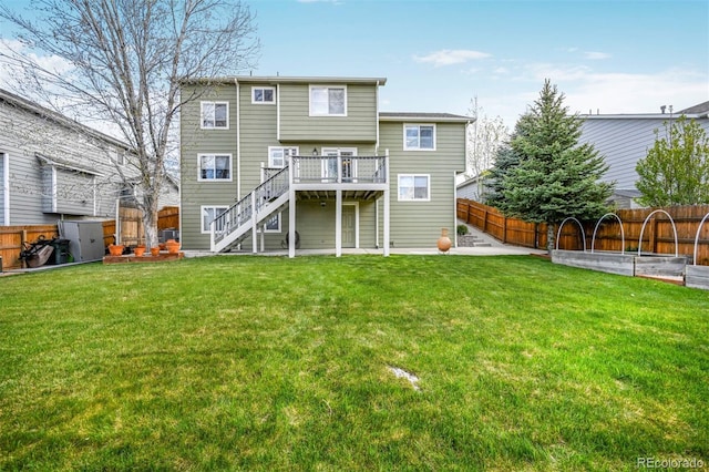 back of property with stairway and a wooden deck