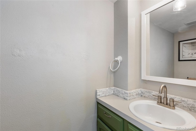 bathroom featuring visible vents and vanity