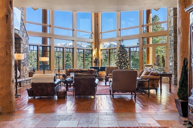 living room featuring hardwood / wood-style flooring and a high ceiling