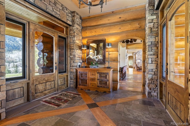 entrance foyer with log walls