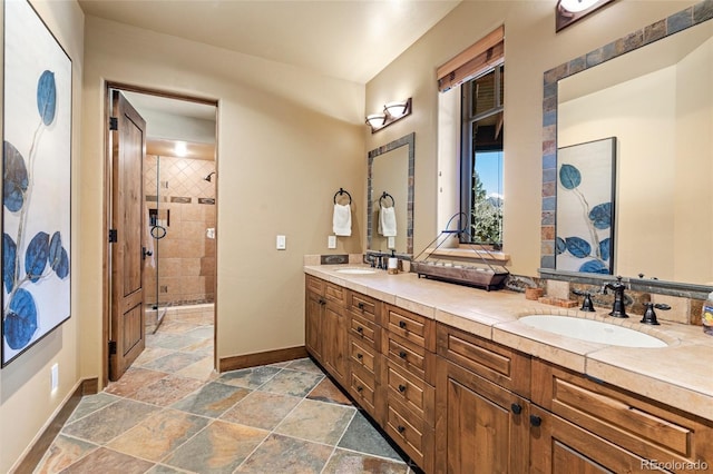 bathroom with vanity and an enclosed shower