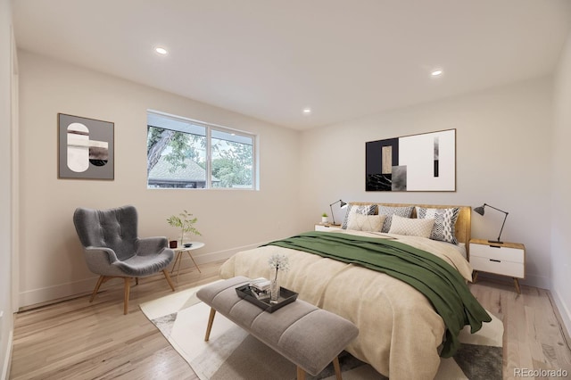 bedroom with light hardwood / wood-style floors