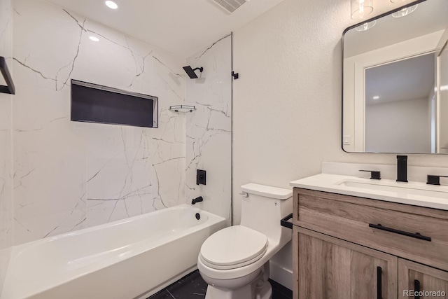 full bathroom featuring tile patterned floors, toilet, vanity, and tiled shower / bath