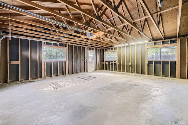 miscellaneous room with concrete flooring and a healthy amount of sunlight