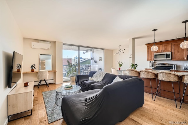 living room featuring expansive windows, a wall mounted air conditioner, baseboard heating, and light wood-type flooring