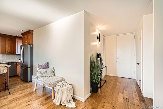 hall with light hardwood / wood-style floors