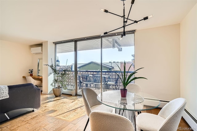 dining area with baseboard heating, a wall unit AC, floor to ceiling windows, and light hardwood / wood-style flooring