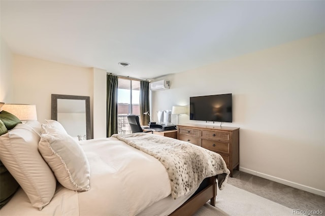 bedroom with light colored carpet and a wall unit AC