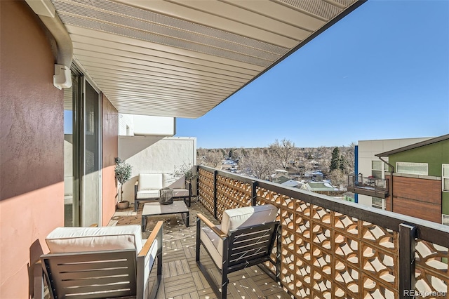 balcony featuring area for grilling and outdoor lounge area