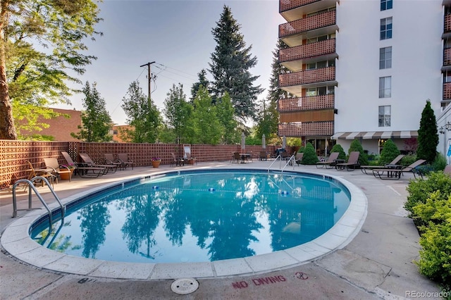 view of swimming pool featuring a patio