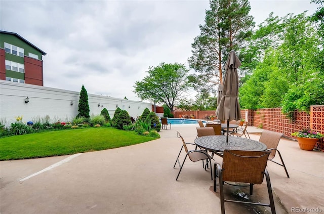 view of patio with a fenced in pool