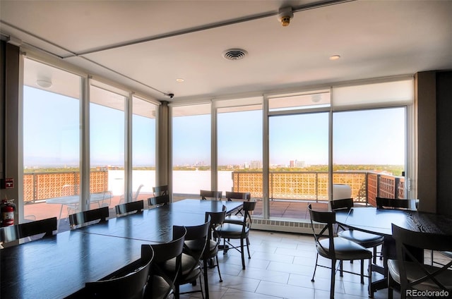 sunroom / solarium featuring a wealth of natural light