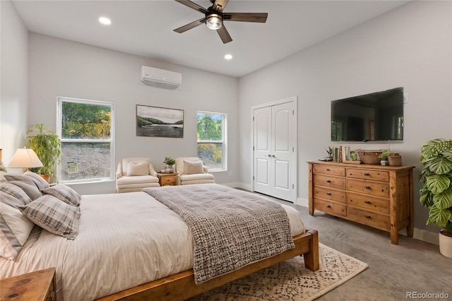 bedroom featuring a closet, a wall mounted AC, and ceiling fan