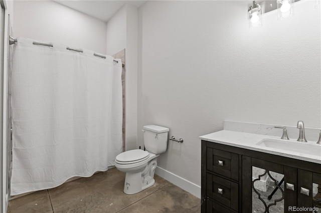 bathroom featuring vanity, curtained shower, and toilet