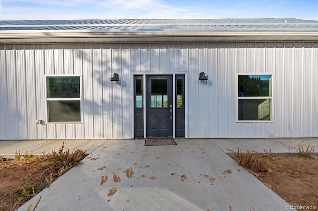 property entrance with a patio