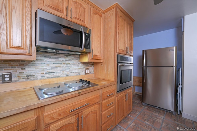 kitchen featuring tasteful backsplash and appliances with stainless steel finishes