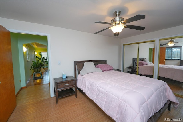 bedroom with hardwood / wood-style flooring and ceiling fan