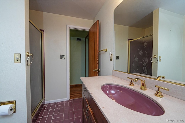 bathroom with vanity, tile patterned flooring, and a shower with door