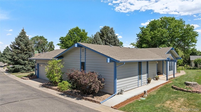 16 Scott Dr N, Broomfield, CO 80020 - view of side of home with roof with shingles and a lawn