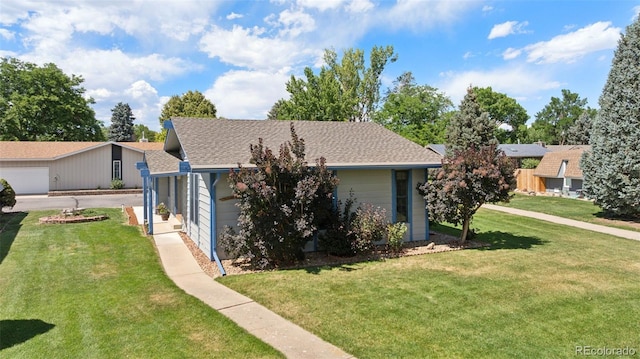 16 Scott Dr N, Broomfield, CO 80020 - view of front of home featuring a front yard, roof with shingles, and a garage
