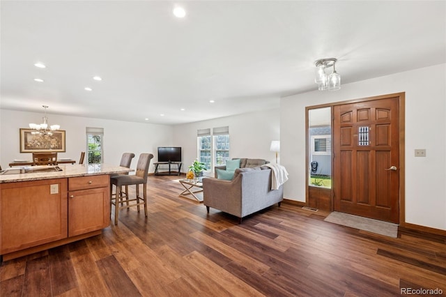 16 Scott Dr N, Broomfield, CO 80020 - living room with a chandelier, recessed lighting, plenty of natural light, and dark wood-type flooring