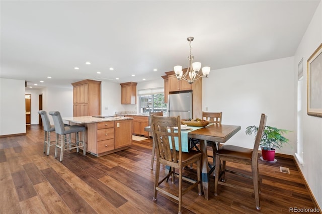 16 Scott Dr N, Broomfield, CO 80020 - dining area featuring dark wood-style flooring, a chandelier, and recessed lighting