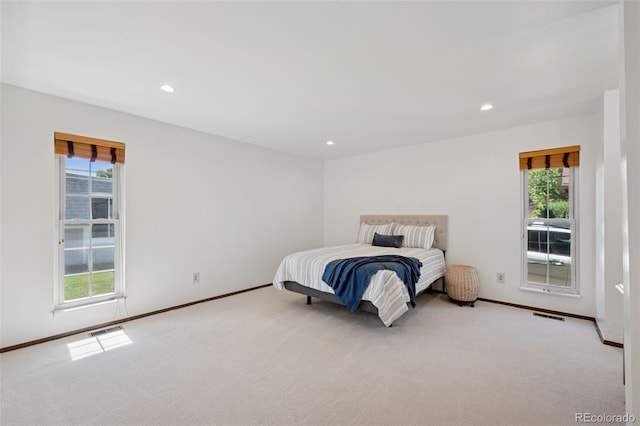 16 Scott Dr N, Broomfield, CO 80020 - bedroom featuring multiple windows, light carpet, and recessed lighting