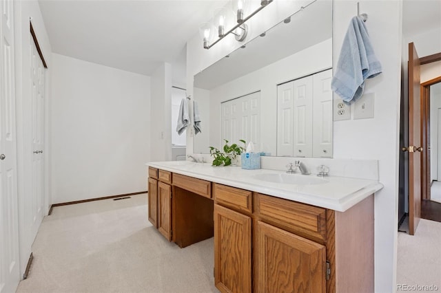 16 Scott Dr N, Broomfield, CO 80020 - full bathroom featuring double vanity and a closet