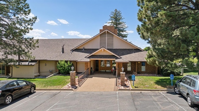 16 Scott Dr N, Broomfield, CO 80020 - view of front of house featuring uncovered parking, roof with shingles, and a front lawn