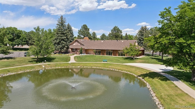 16 Scott Dr N, Broomfield, CO 80020 - rear view of house featuring a water view, a chimney, and a yard